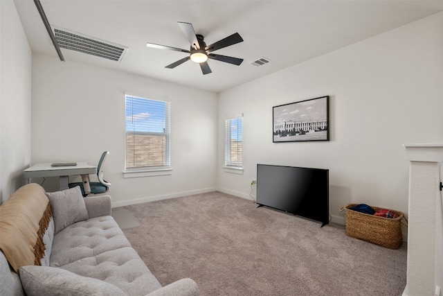 carpeted living room featuring ceiling fan