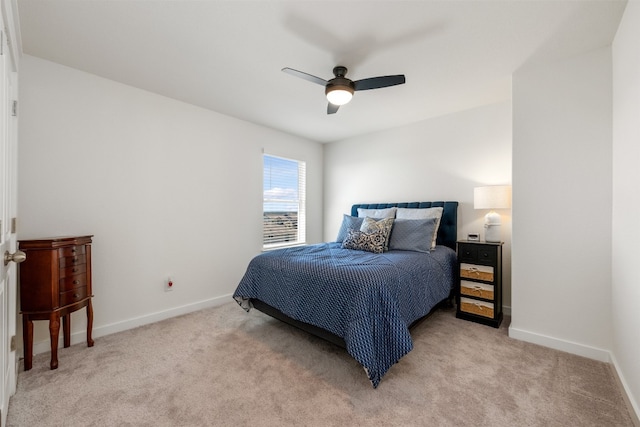 bedroom featuring ceiling fan and light carpet