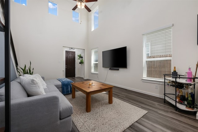 living room with plenty of natural light and dark hardwood / wood-style floors