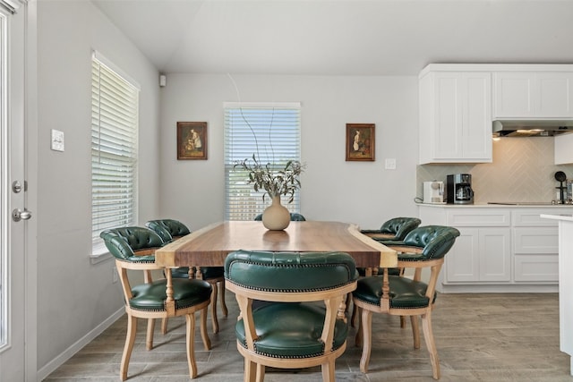 dining area featuring a wealth of natural light and light hardwood / wood-style floors