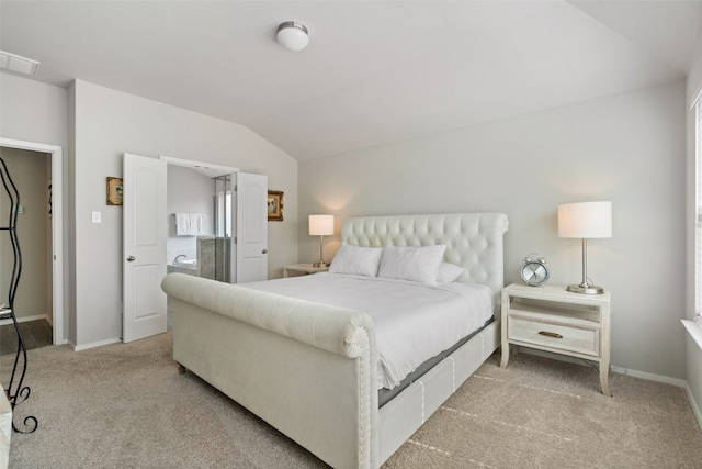 carpeted bedroom featuring lofted ceiling