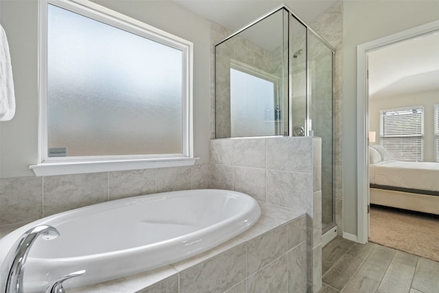 bathroom with plus walk in shower and hardwood / wood-style flooring