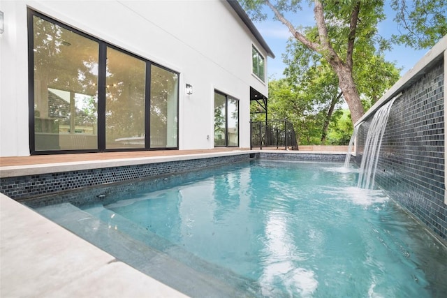 view of pool with pool water feature