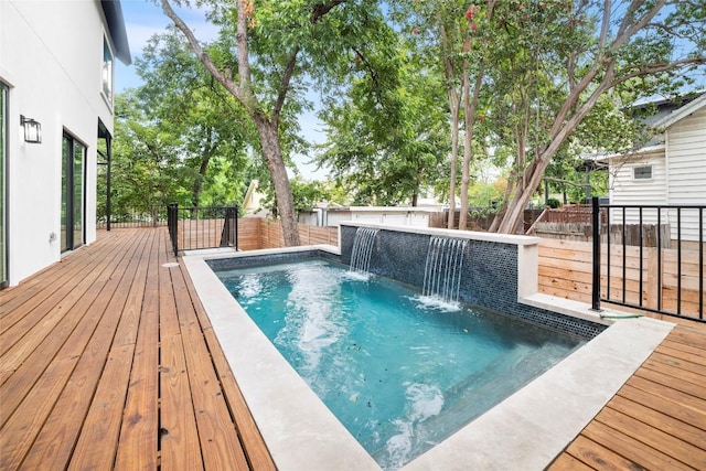 view of pool featuring a wooden deck and pool water feature