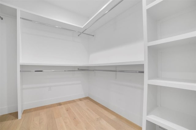 walk in closet featuring hardwood / wood-style floors