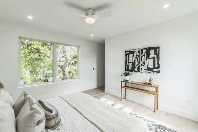 bedroom with ceiling fan and light wood-type flooring