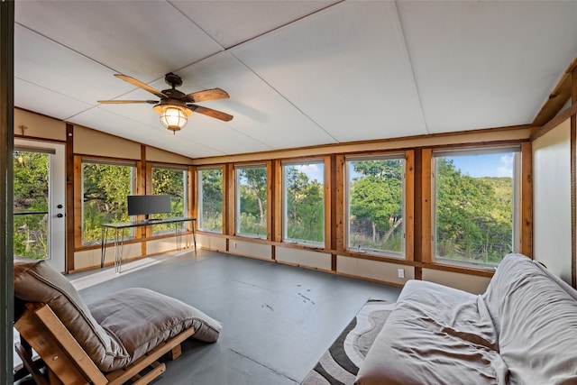 sunroom / solarium featuring ceiling fan and vaulted ceiling