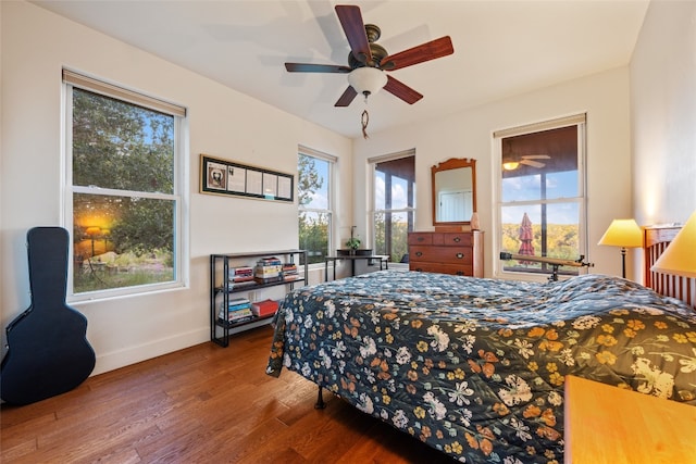 bedroom with hardwood / wood-style floors and ceiling fan