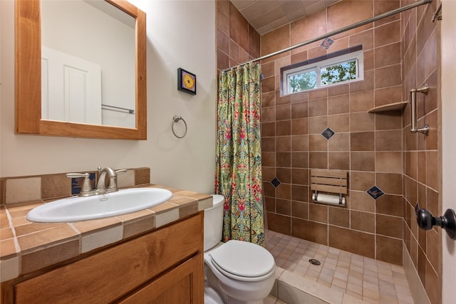 bathroom with a shower with curtain, toilet, and vanity