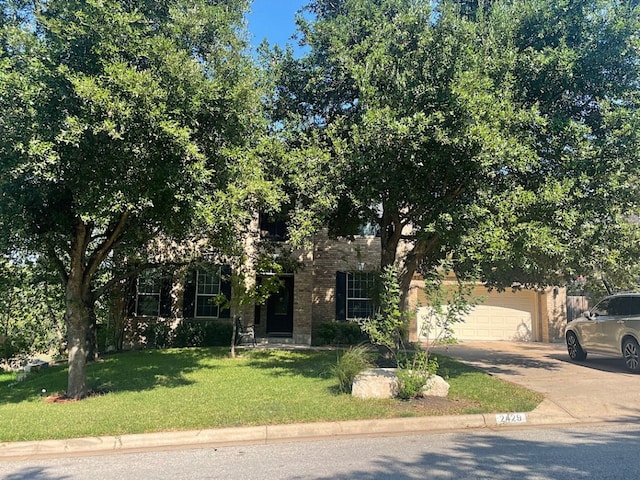 obstructed view of property with a front yard