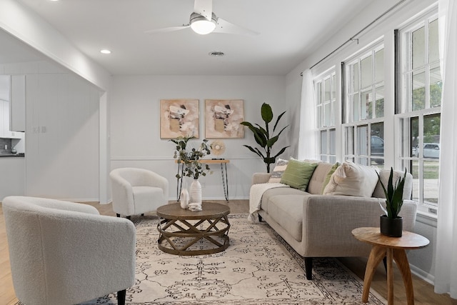 living room with recessed lighting, visible vents, baseboards, and a ceiling fan