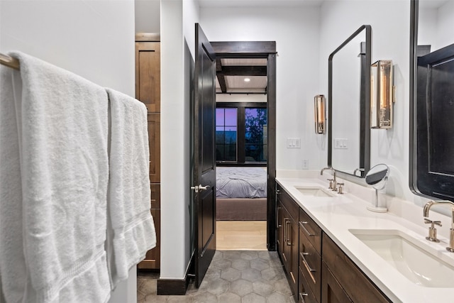 bathroom with vanity and tile patterned floors