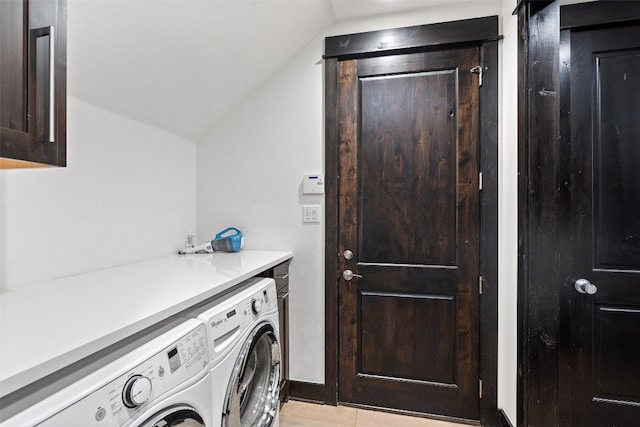 laundry area featuring cabinets and washing machine and dryer