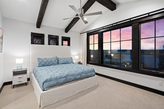 bedroom featuring lofted ceiling with beams, light colored carpet, and ceiling fan