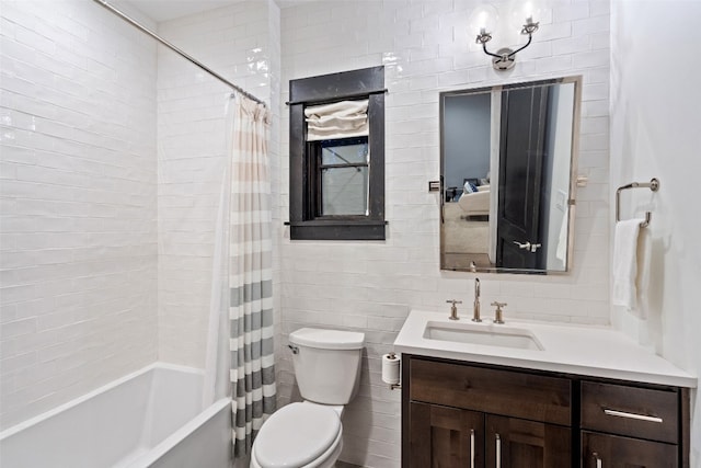 full bathroom with tile walls, toilet, shower / tub combo with curtain, and vanity