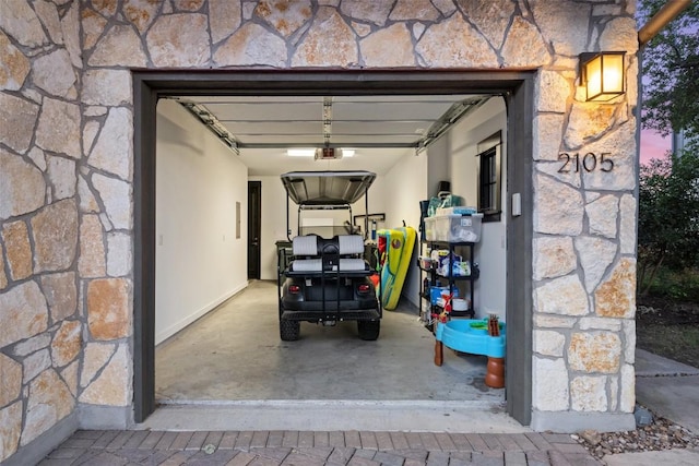 2105 Keeneland Cv Unit 6, Spicewood, TX 78669 - garage featuring a garage door opener
