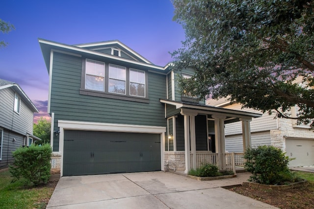 view of front of property with a garage and a porch