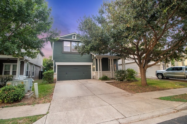 view of front of property featuring a garage and a porch