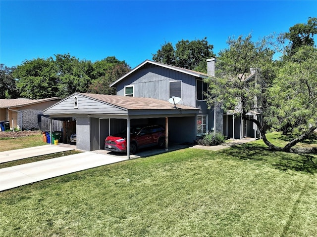 exterior space featuring a front lawn, concrete driveway, a chimney, and a carport
