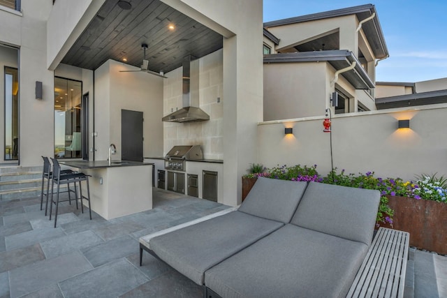 view of patio / terrace featuring area for grilling, a wet bar, and outdoor lounge area