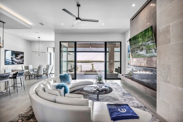 living room with tile walls and ceiling fan