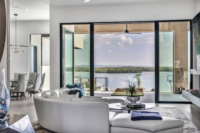 tiled living room featuring a water view