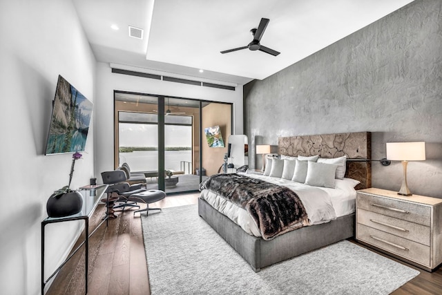 bedroom with access to exterior, ceiling fan, and dark hardwood / wood-style flooring