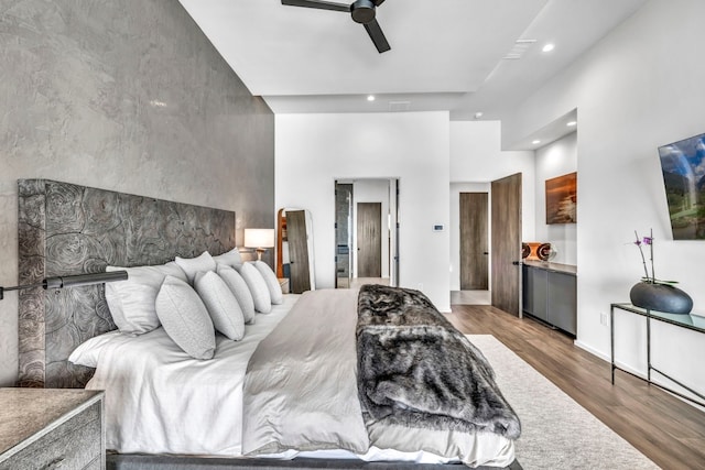 bedroom featuring hardwood / wood-style floors and ceiling fan