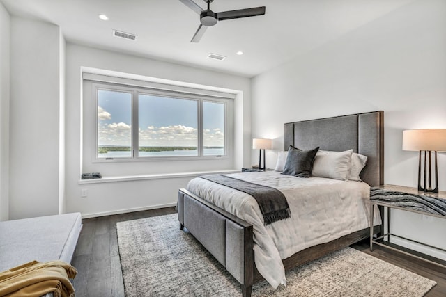 bedroom featuring ceiling fan and dark hardwood / wood-style floors