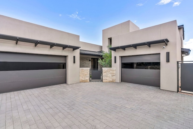 southwest-style home featuring a garage