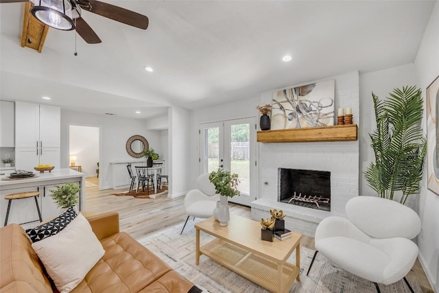 2110 Malvern Hill Dr, Austin, TX 78745 - living room with ceiling fan, recessed lighting, baseboards, a brick fireplace, and light wood finished floors