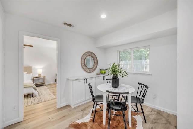 2110 Malvern Hill Dr, Austin, TX 78745 - dining area featuring light wood-style flooring and baseboards