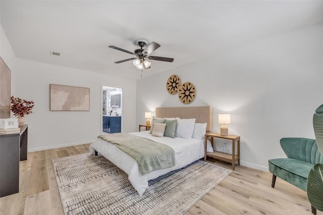 2110 Malvern Hill Dr, Austin, TX 78745 - bedroom with light wood-style floors, baseboards, ceiling fan, and connected bathroom