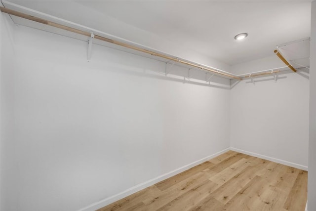 2110 Malvern Hill Dr, Austin, TX 78745 - walk in closet with wood finished floors