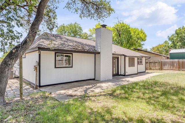 2110 Malvern Hill Dr, Austin, TX 78745 - rear view of house featuring a chimney, a patio, roof with shingles, and cooling unit