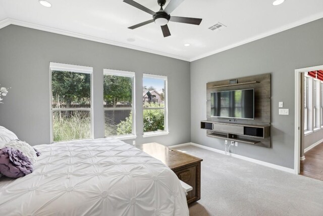 bedroom with ceiling fan, crown molding, and wood-type flooring