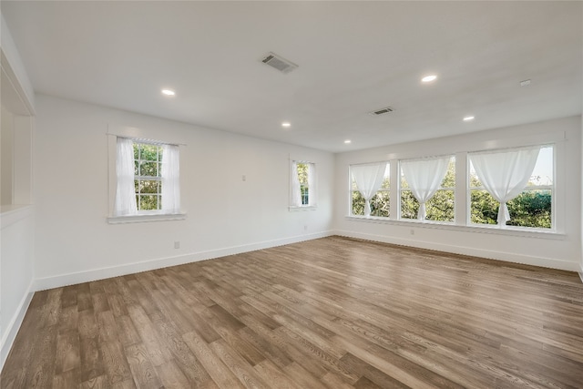 empty room featuring hardwood / wood-style flooring