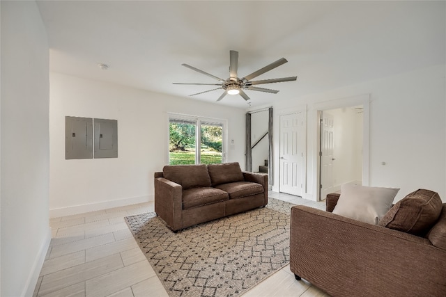 living room with electric panel and ceiling fan