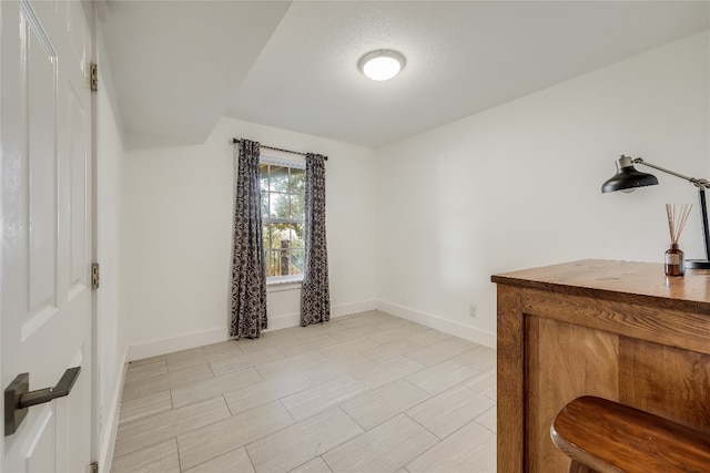 interior space with a textured ceiling