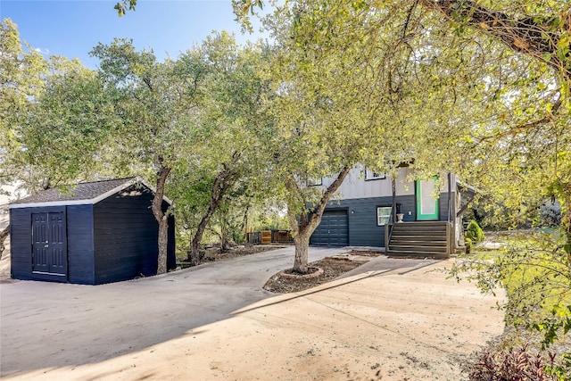 view of front facade featuring a garage and a carport