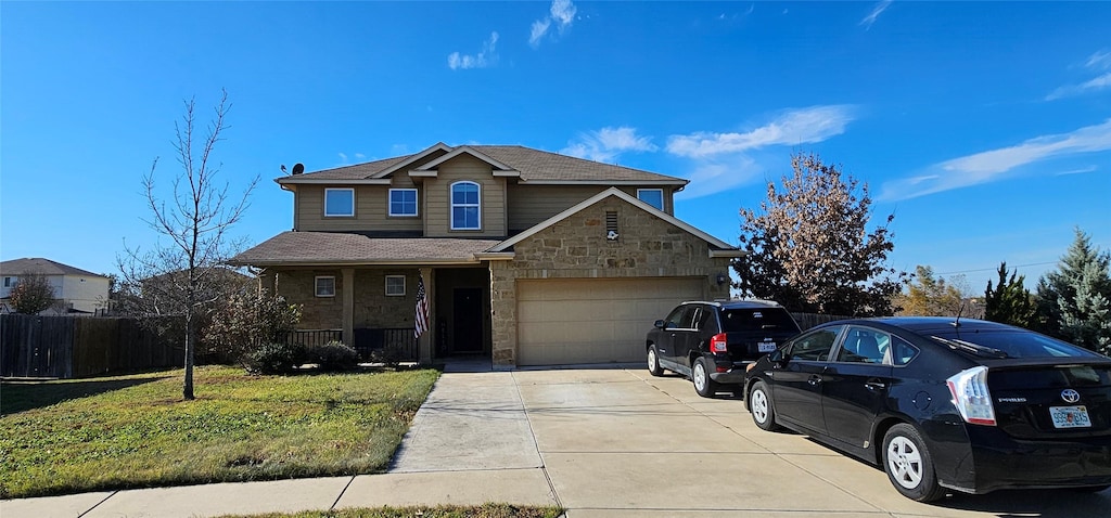 view of front property featuring a front yard and a garage