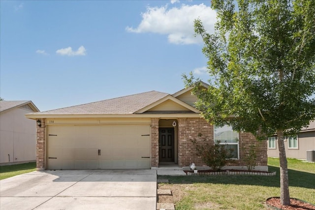 single story home featuring a garage and a front lawn