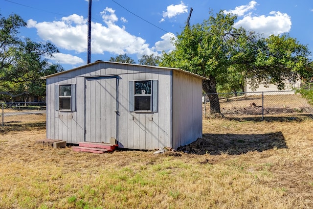 view of outbuilding with a lawn