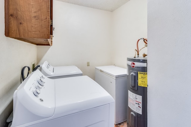 clothes washing area featuring cabinets, separate washer and dryer, water heater, and a textured ceiling