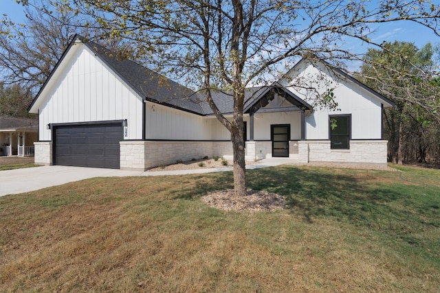 modern inspired farmhouse with a front yard and a garage