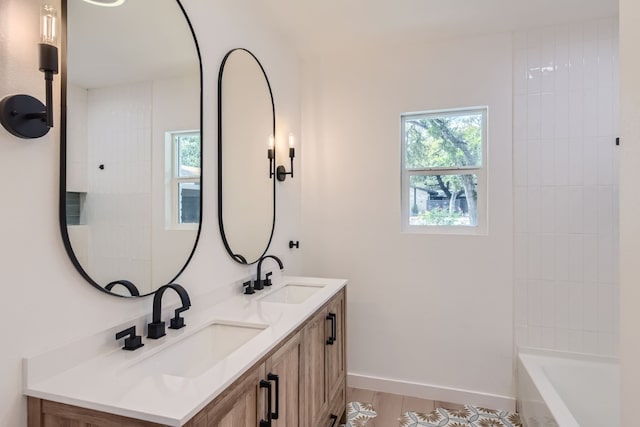 bathroom featuring vanity and plus walk in shower