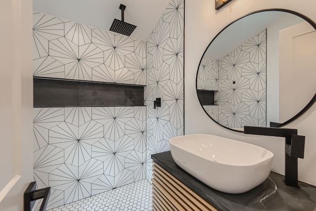 bathroom featuring vanity, walk in shower, and tile patterned floors