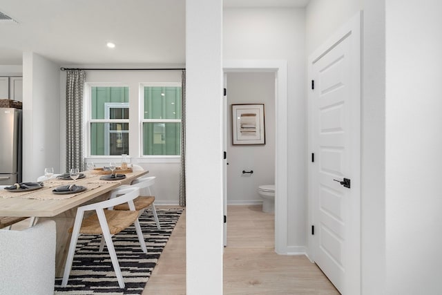 dining area with light hardwood / wood-style floors