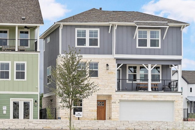 view of front of house featuring a balcony and a garage