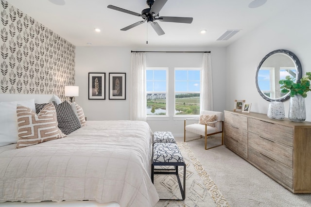 carpeted bedroom featuring ceiling fan